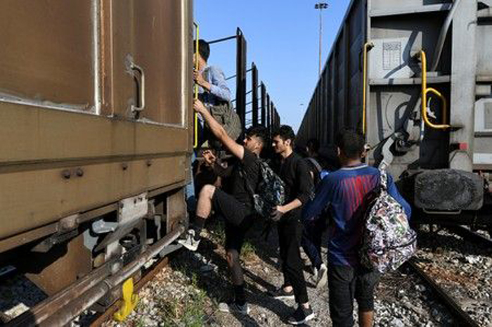 Migrant stowaways ride Greek freight trains seeking escape to north ...