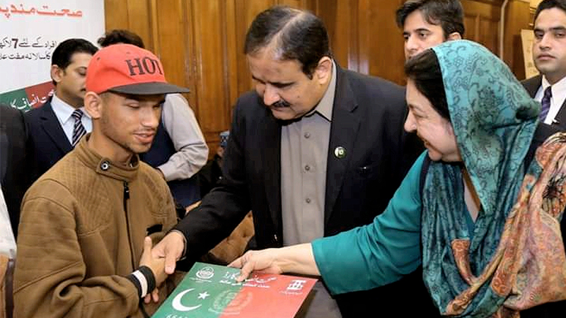Buzdar distributes Sehat Insaf Cards among special persons