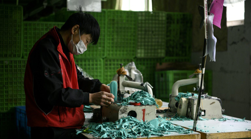 One worker at a time, virus-hit China’s factories sputter back online