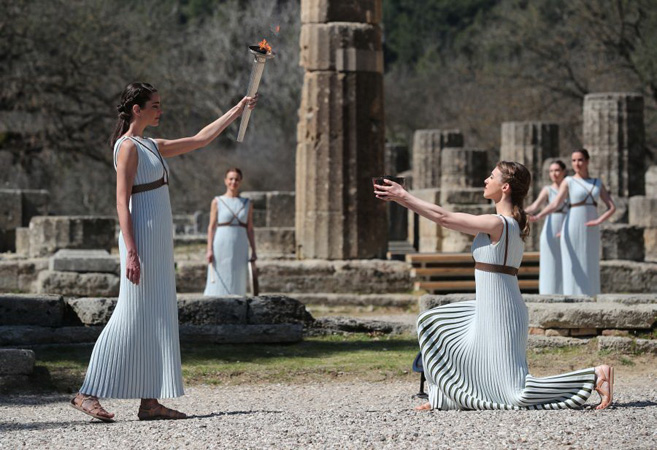 Tokyo Olympics 2020 torch lit behind closed doors in ancient Olympia