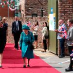 Queen Elizabeth treads cobbles on set of longest-running soap
