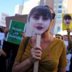 Protesters gather in support of Iranian women and against the death of Mahsa Amini at Callao square in Madrid, Spain, October 1, 2022. REUTERS