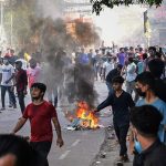 32 dead in Bangladesh unrest, protesters set fire to state TV network